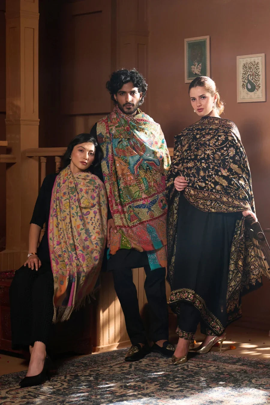Group shot featuring Taroob luxury embroidered Pashmina, Kalamkari, and Tilla shawls for men and women